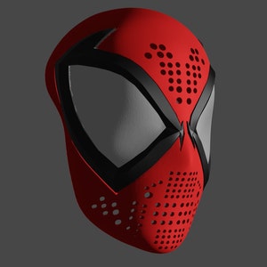 以下が含まれることがあります： 黒と赤のスパイダーマンのマスク。黒いクモの模様と穴の開いた前面があります。