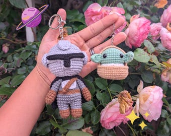 Space Bounty Hunter and Green Baby Creature Crochet Keychains | Handmade Cute Duo Bag Charm Set | Kawaii Sci-Fi Plush Gifts