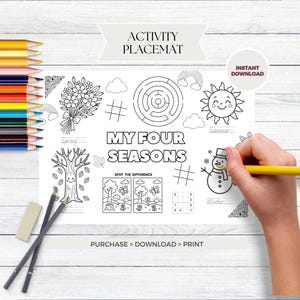 May include: A black and white activity placemat with the text "My Four Seasons" and various seasonal illustrations. Includes a maze, a snowman, a sun, and a bouquet of flowers. A hand is holding a yellow pencil.