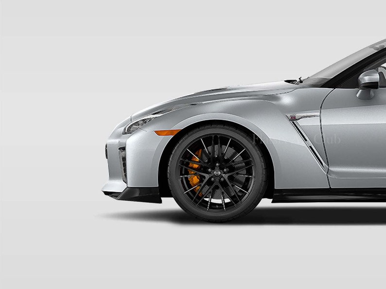 May include: A silver sports car with black wheels and orange brake calipers. The car is viewed from the side, with the front wheel and fender in focus.