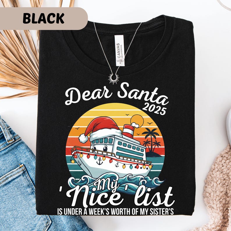 May include: Black t-shirt with a graphic featuring a cruise ship wearing a Santa hat, the text "Dear Santa 2025", and "My Nice List". The design includes a sunset and palm trees.