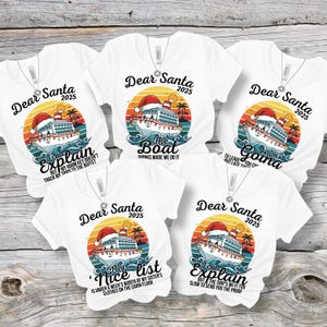 May include: White t-shirts with cruise ship graphics and the text "Dear Santa 2025." Each shirt has a different humorous phrase, such as "I can explain but my room key doesn't track my trips to the buffet."