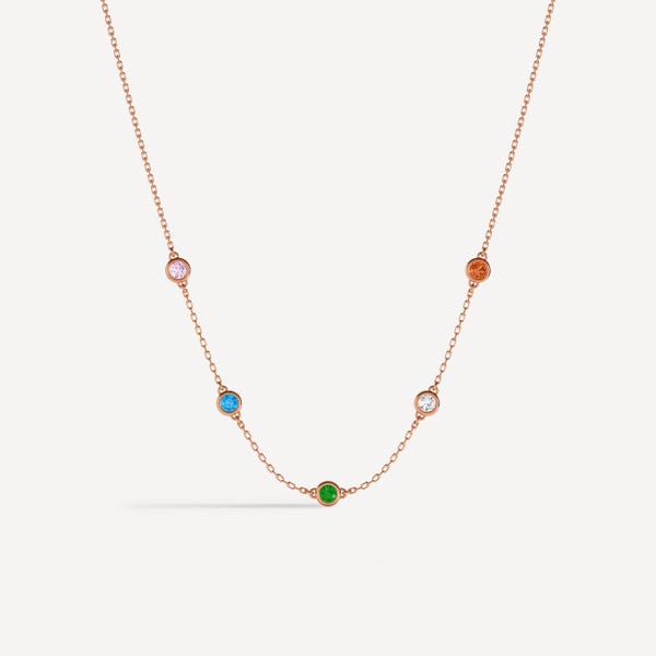 Vergulde geboortesteenketting, ketting met meerdere stenen in een vaste zetting.