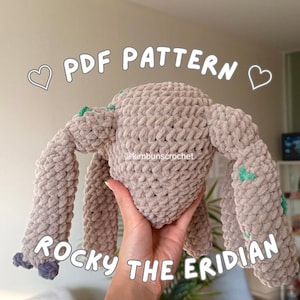 May include: A handmade, beige crochet creature named "Rocky the Eridian" with green and blue accents. The image includes the text "PDF PATTERN" and the Instagram handle "@kimbunscrochet".