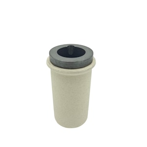 May include: A small, off-white ceramic crucible with a dark gray, circular lid. The crucible has a cylindrical shape with a textured surface. The lid has a central, rounded protrusion. The item is set against a plain white background.