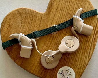 Grünes rutschfestes Gehörschutzband mit farblosen Schiebern und mit Gummischlaufen