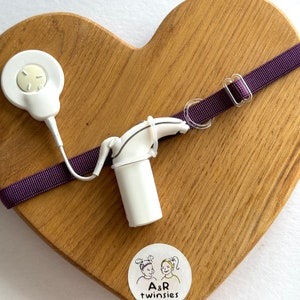 Dark purple color non slip hearing implant headband with rubber loops