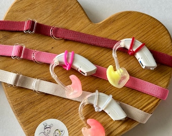 Rutschfeste, rötliche Töne Stirnbänder für Hörgeräte.