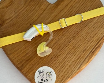 Yellow non slip hearing aid headband with rubber loops