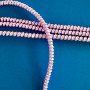 2 piece plastic protective cable (pink) for the protection of hearing implants and hearing aids