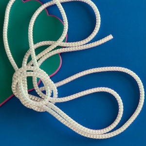 Plastic protective 30cm long cable (white) for the protection of hearing implants and hearing aids