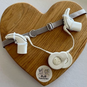 Gray non slip hearing implant headband with colorless sliders and with rubber loops
