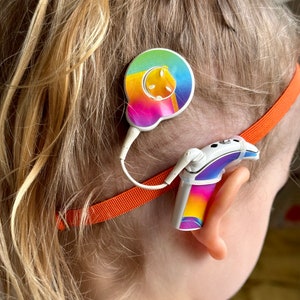 Orange non slip hearing implant headband with rubber loops