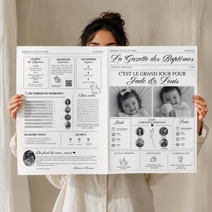 Może przedstawiać: Program wydarzenia w stylu gazety zatytułowany La Gazette des Baptêmes, datowany na 14 lipca 2026 roku. Zawiera czarny tekst i grafikę na białym tle, w tym dwa czarno-białe zdjęcia niemowląt, wykreślankę oraz szczegóły dotyczące wydarzenia.