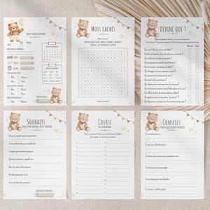 Peut inclure: Ensemble de cartes de jeux pour une baby shower, sur le thème de l'ours en peluche. Les cartes comprennent des jeux comme "Devine qui ?" et une recherche de mots, ainsi que des espaces pour les informations du bébé.