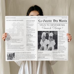 Può includere: Una persona tiene in mano un giornale in bianco e nero intitolato "La Gazette Des Mariés" con il titolo "VEUX TU DEVENIR MA Témoin de Mariage?" Il giornale presenta articoli, un cruciverba e una foto di due donne.