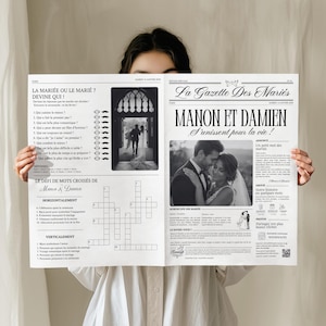 Peut inclure: Une annonce de mariage de style journal avec le titre "La Gazette Des Mariés" et les noms "Manon et Damien". L'annonce comprend une photo du couple, des mots croisés et d'autres contenus liés au mariage.