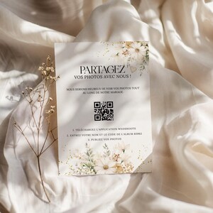 May include: A rectangular invitation card with floral accents and the text "PARTAGEZ VOS PHOTOS AVEC NOUS!" in a decorative font. The card includes a QR code and instructions for sharing photos at a wedding.
