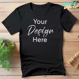 Puede incluir: Camiseta negra con el texto "Your Design Here" en blanco.