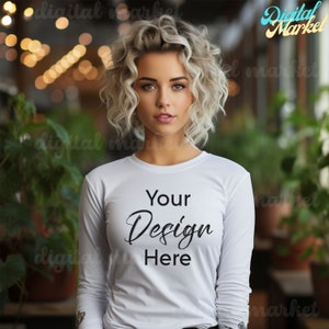 May include: A white long-sleeved shirt with the text "Your Design Here" printed on the front.