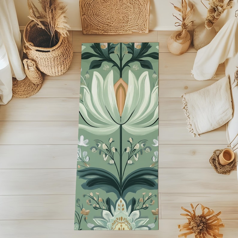 May include: A green yoga mat with a floral pattern featuring white flowers and green leaves. The pattern is symmetrical and has a vintage aesthetic.