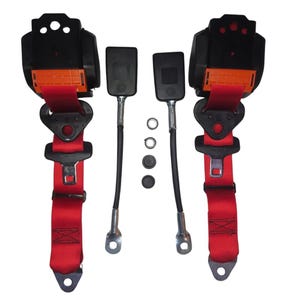 May include: Two red racing harnesses with black buckles and orange accents. The harnesses are attached to black metal clips with silver rings. The harnesses are on a white background.