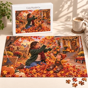 Könnte beinhalten: Eine Puzzleschachtel und ein fertiges Puzzle mit einer Herbstszene, auf der eine Person in einer grünen Strickjacke und ein Kind in einer orangefarbenen Latzhose in einem Garten voller Ahornblätter und Kürbisse vor einem Haus sitzen.