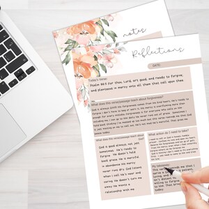 May include: A laptop and two sheets of paper with floral accents. The top sheet reads "notes" and the bottom sheet reads "Reflections." The papers contain handwritten text about forgiveness and a verse from Psalm 86:5.