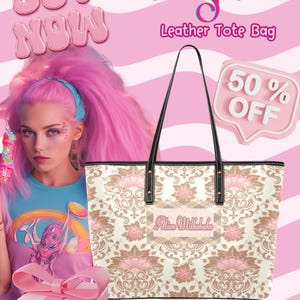 May include: A white leather tote bag with a pink and brown floral pattern. The bag has black straps and a black leather trim. The bag has the text "Alien Milkshake" printed on the front. The bag is 50% off.
