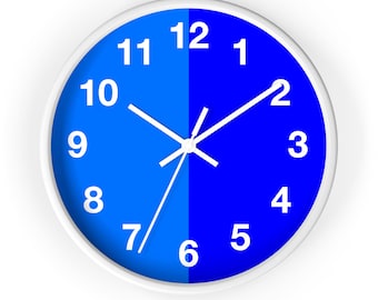 May include: A white clock face with black hour and minute hands. The clock face is divided in half, with the left side blue and the right side white. The numbers 1 through 12 are printed in white around the clock face.
