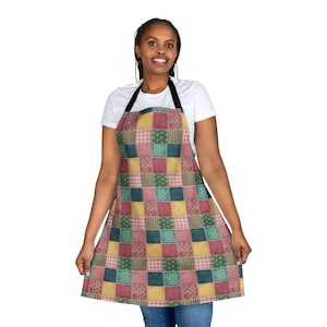 May include: A patchwork-style apron with a variety of colors and patterns, including red, green, yellow, and blue. The apron has adjustable straps and a large pocket in the front.