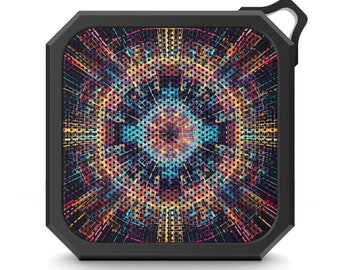 May include: A black square-shaped portable Bluetooth speaker with a colorful geometric design on the front.