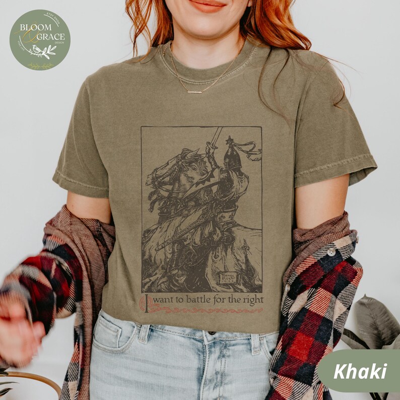 May include: A khaki green t-shirt with a vintage illustration of a knight on horseback. The text "I want to battle for the right" is printed below the image.