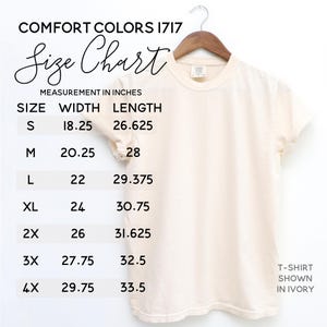 May include: Size chart for a t-shirt in sizes S through 4X. The chart shows the width and length measurements in inches. The t-shirt is shown in ivory.
