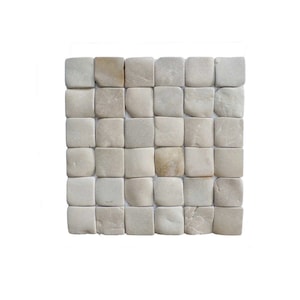 May include: A square mosaic tile sheet composed of numerous small, square, natural-toned stones. The stones vary in color from light beige to tan, creating a subtle, textured pattern. The tiles are arranged in a grid, suitable for wall or floor applications.