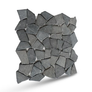 May include: A sheet of gray stone mosaic tiles arranged in a random pattern. The tiles are irregular in shape and size, and they are set on a mesh backing.