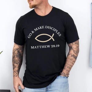 May include: Black t-shirt with a white graphic of a fish and the text "Go & Make Disciples Matthew 28:19"