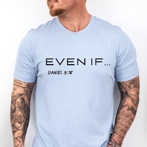 May include: Light blue t-shirt with the text "EVEN IF..." and "DANIEL 3:18" printed in black.