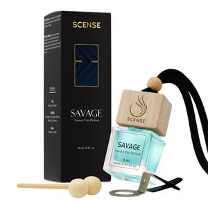 May include: A black rectangular box labeled SCENSE SAVAGE Luxury Car Parfum 8 ml 0.27 oz next to a glass bottle with light blue liquid, a wooden cap, a black hanging cord, and a metal clip. The box lists scent notes including bergamot and pepper.