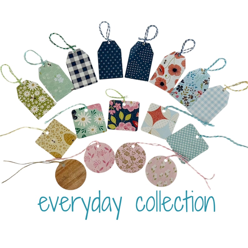 May include: A collection of 18 gift tags featuring a variety of patterns and designs. The tags are made from paper and have twine strings. The tags include floral, geometric, and polka dot patterns in shades of blue, green, pink, and yellow. The text "everyday collection" is printed at the bottom of the image.