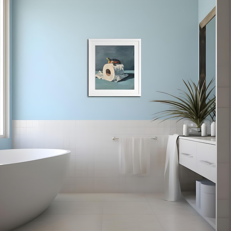 May include: A framed artwork depicts a turtle atop a roll of toilet paper. The painting has a blue and white color scheme, with the turtle's shell showing green, brown, and yellow hues. The artwork is displayed in a bathroom setting.