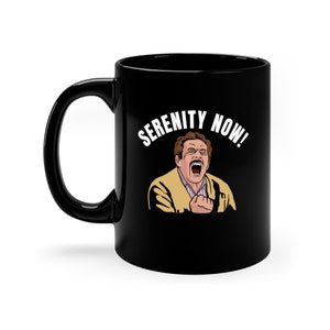 May include: Black ceramic coffee mug with a white graphic of a man yelling "Serenity Now!"