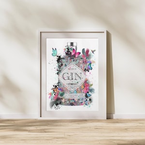 May include: A white framed print of a watercolor illustration of a gin bottle with butterflies and floral accents. The bottle label reads "Premium Gin".