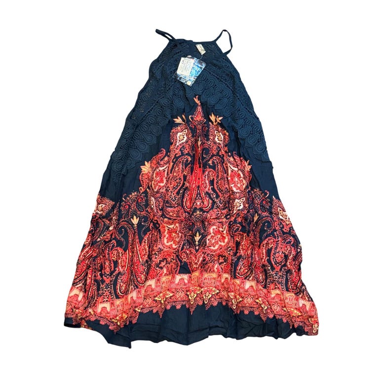 May include: A long, navy blue halter dress with a paisley pattern in red, orange, and gold. The top of the dress features a crocheted design. A tag is attached to the dress.