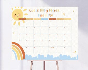 May include: A baby shower calendar with the text "Guess Baby Flores Due Date." The calendar features a smiling sun, a rainbow, and blue clouds. The calendar grid is light blue and orange.