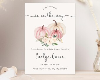 May include: A baby shower invitation with a pink and white pumpkin theme. The invitation says "A little pumpkin is on the way" and includes the name "Evelyn Davis".