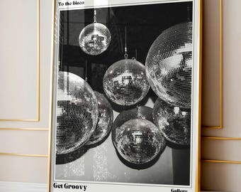 May include: Black and white photograph of a disco ball hanging from the ceiling. The image is titled "To the Disco" and "Get Groovy" and is part of a "Gallery Exhibition" series.