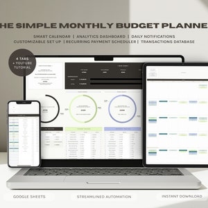 May include: A laptop computer displaying a Google Sheets spreadsheet with a monthly budget planner. The spreadsheet includes a calendar, analytics dashboard, daily notifications, customizable set up, recurring payment scheduler, and transactions database. The laptop is on a white surface with a smartphone and tablet displaying the same spreadsheet.