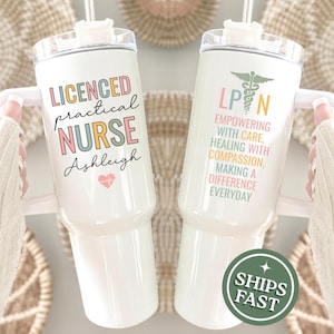 May include: Two white insulated tumblers with lids and straws. One tumbler reads "LICENSED practical NURSE Ashleigh" with a heart. The other reads "LPN Empowering with Care, Healing with Compassion, Making a Difference Everyday."