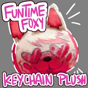 May include: A pink and white Funtime Foxy keychain plush. The plush toy features a cartoon fox face design with pink accents. The text "Funtime Foxy" and "Keychain Plush" are in pink. The background is grey.